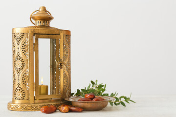 Muslim lantern and dates on light background