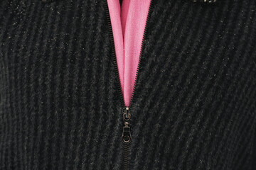 Zipper closure in gray knitted clothes