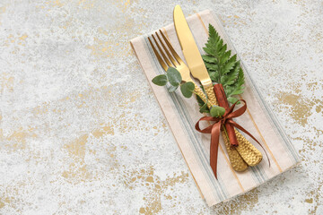 Stylish cutlery on light background