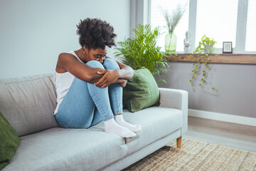 Depressed upset young woman feeling hurt sad stressed troubled with unwanted pregnancy, regret...