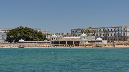 Fototapeta na wymiar La caleta beach in Cadiz, with building of the headquarters of the Underwater Archeology Center of Andalusia