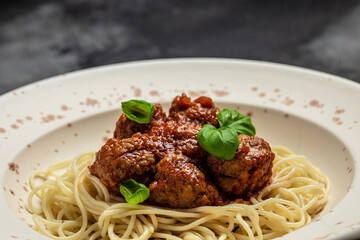Close-up of Italian pasta with tomato sauce and meatballs. Restaurant menu, dieting, cookbook recipe top view