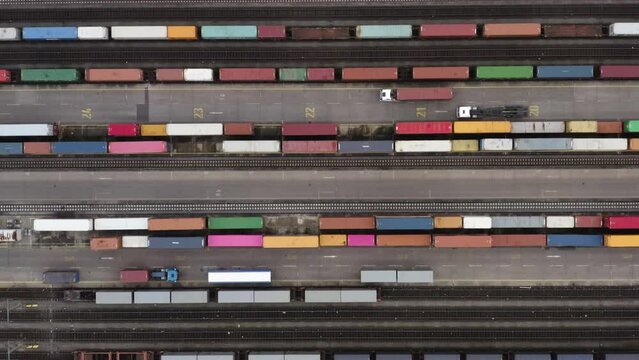 Aerial view multicolored train cars on tracks at railyard, Germany
