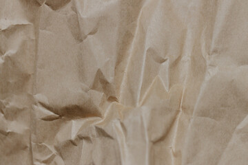 The texture of crumpled craft paper. Background. Close-up.