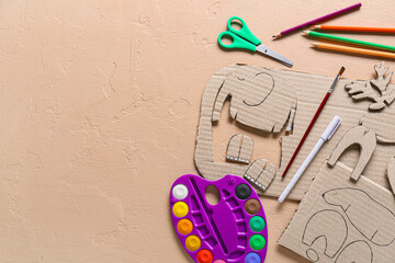 Set of stationery supplies for handcraft and cardboard toys on color background © Pixel-Shot