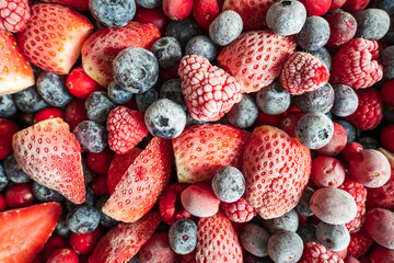 frozen mix strawberries blueberries raspberries and cranberries closeup