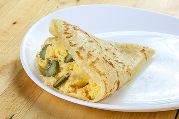 Pancake with. potato and pickled cucumbers