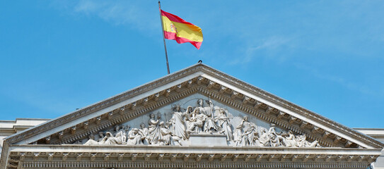 Frescoes on the top of Spanish Parliament building in Madrid, Spain