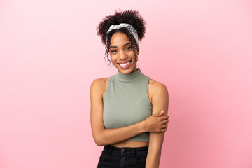 Young latin woman isolated on pink background laughing