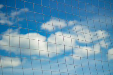 Net of rope against sky. Volleyball net. Inventory for game.