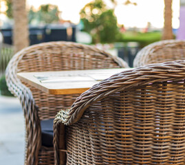 Close up shot of outdoors wicker furniture. Cafe