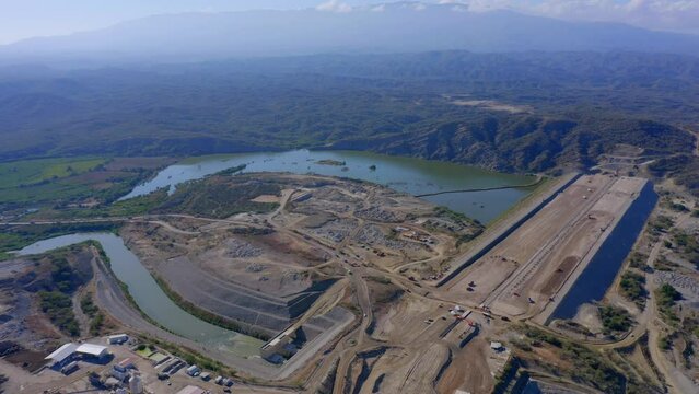 Aerial View High Up of Dam Construction Site Earth Works and Reservoir Development Project, Monte Grande, Barahona, Dominican Republic