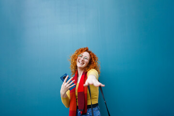 A woman dancing a having fun with her smartphone