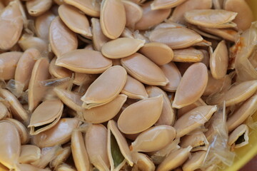 Dried pumpkin seeds close-up top view