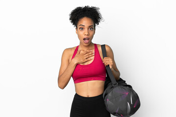 Fototapeta na wymiar Young sport african american woman with sport bag isolated on blue background surprised and shocked while looking right
