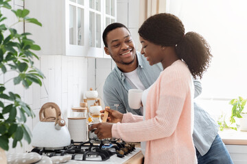 Portrait Of Smiling African American Couple Spending Time In Kitchen Together