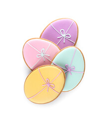 Easter cookies in shape of eggs with bows on white background