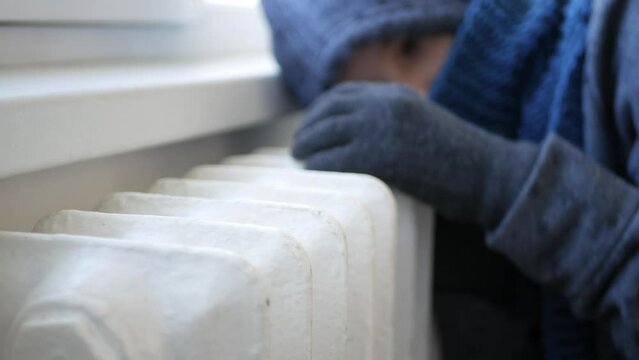 Global Energy Crisis, Hot Thermic Radiator, Girl in Winter Shivering from Cold Warmth by Heater, Child in Poverty, Kid Trembling 