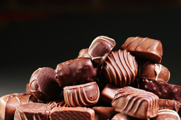 stack of many dark chocolate on black 