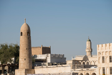 Obraz premium Doha, Qatar, May,6,2019, Traditional Arabian mosque with minarets in old market Souk Waqif.