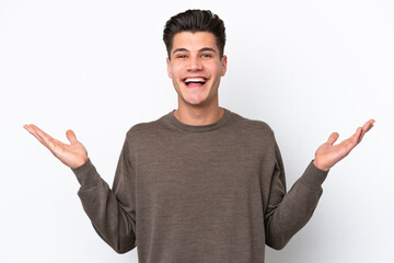 Fototapeta premium Young handsome caucasian man isolated on white bakcground with shocked facial expression