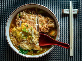 Concept: Asian food. Ramen bowl on the table in a Japanese restaurant