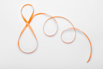 Figure 8 made of ribbon for International Women's Day celebration on white background