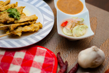 Pork satay - Grilled pork served with peanut sauce or sweet,sour sauce and toast,  Thai street food and delicious food in the restaurant.