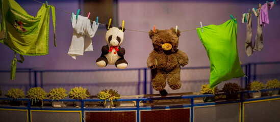 Teddy bears drying on the string