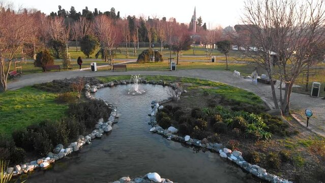 4K Fountain of water in a public park of Istanbul city with people walking there