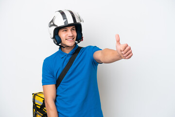 Young caucasian man with thermal backpack isolated on white background giving a thumbs up gesture
