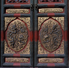 China/Beijing: Imperial Palace, Forbidden City, gugong; Door; carved; dragon symbols, Gold metal lace on door,