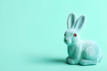 Cute Easter bunny on turquoise background