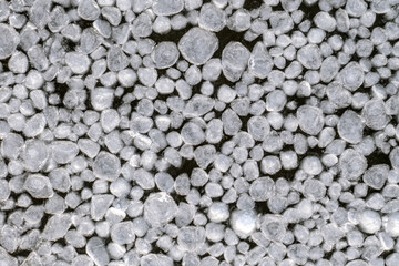 abstract texture of broken ice and dark water. background of the frozen surface of a clean lake or river