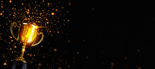 Champion golden trophy isolated on black background, first place, best win symbol. - obrazy, fototapety, plakaty