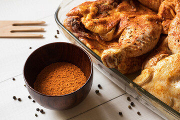 Chicken quarters with spices prepared for roast
