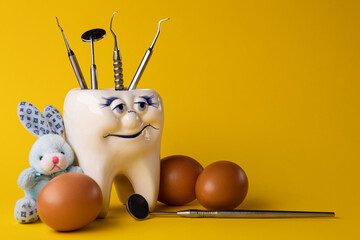 Dental health concept. Dentist day concept. Flat lay, top view, copy space for text.stomatology.Happy easter.Stomatology concept.eggs, dentist tools and teeth 