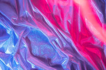 Violet fabric with magenta light trail. Futuristic abstract background.