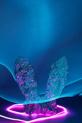 Easter bunny aluminum foil ears with pink and blue neon lights. Cyberpunk holiday background.