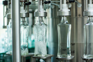 Bottles with a drink closed with a screw cap. Factory for the production of alcoholic beverages