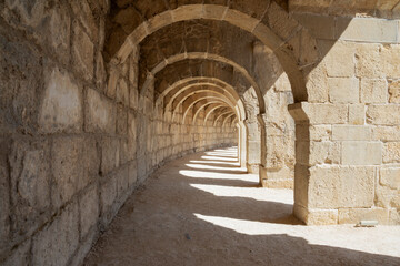 The columned Arch gallery above the auditorium-theatre in the Ancient Roman Theater of Aspendos. Arch in ancient amphitheater.