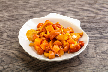 Marinated pickled honey mushrooms in the bowl