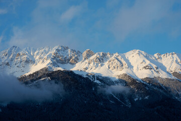 Obraz premium Mountain panorama with snowy mountains and blue sky in the alps