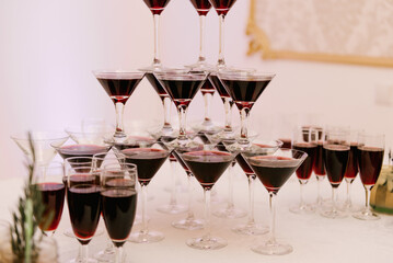 A beautiful and delicious festive buffet with snacks in glasses, hot cocktails and wine