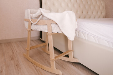 Fototapeta na wymiar Beautiful cute wooden baby cradle, eco crib