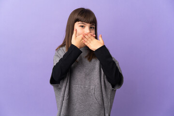 Little girl over isolated background covering mouth with hands