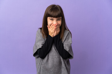 Little girl over isolated background happy and smiling covering mouth with hands