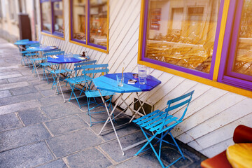 French restaurant - tables and chairs in the row - 487991029