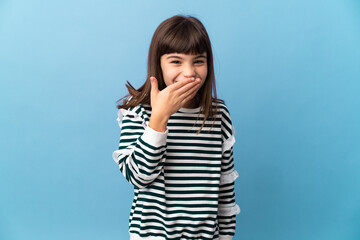 Little girl over isolated background happy and smiling covering mouth with hand