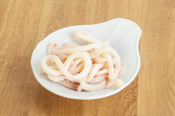 Marinated squid strips in the bowl